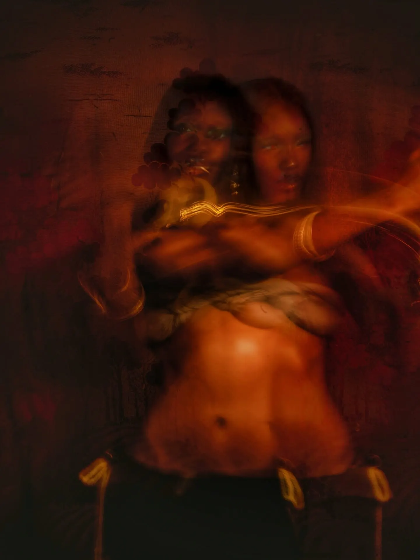 Dreamlike double exposure of the model in motion, two overlapping figures dissolving into deep red shadow.